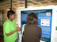 Matroner George '07 explains her poster at the MERCURY conference.