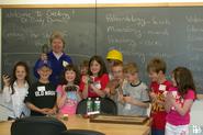 Students from Seneca Elementary School examine fossils with Geosciences Professor Cindy Domack.