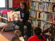 Sarah Schrader '09 reads to students at Clinton elementary.