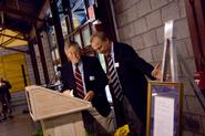 Bob Bloomer '50, left, is honored as Volunteer of the Year by Mark Rice '73, .