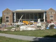 Sheets of glass are being installed (right) in the Science Center.