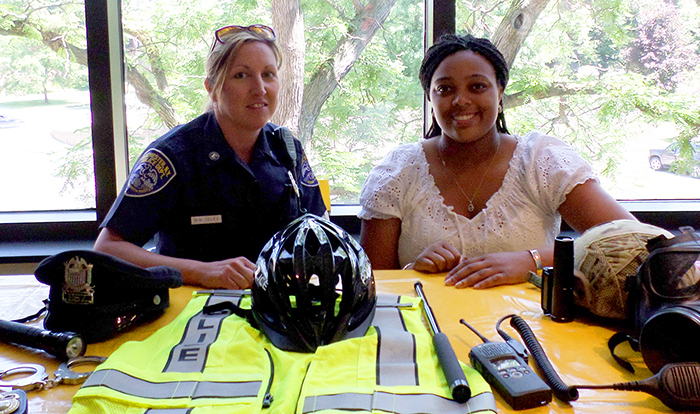 Alessandria Dey '15, right, with Rochester police officer Michelle Velez.