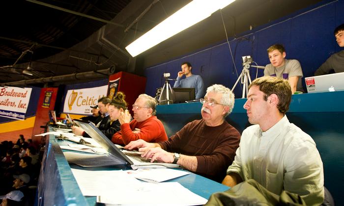 As part of his shadowing day Greg Scott '14 covered a hockey game with Utica <em>Observer-Dispatch</em> reporter John Pitarresi '70 PHOTO: BY NANCY FORD