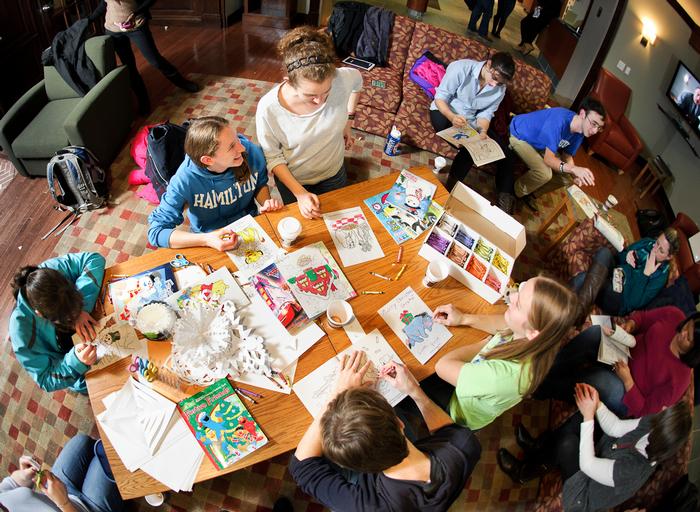 Students color and make paper snow flakes as they participate in a Student Activities big study break in Sadove Center. PHOTO: BY NANCY FORD
