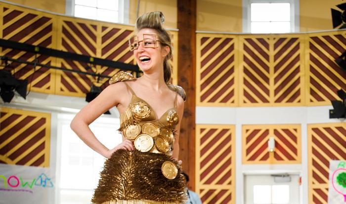 Model Annie Phillips '13 shows off a dress designed by Emily Anderson '13 and made of plastic lids and straws, during the Recycling Task Force's Trashion Show. The dress won first prize. PHOTO: BY NANCY L. FORD